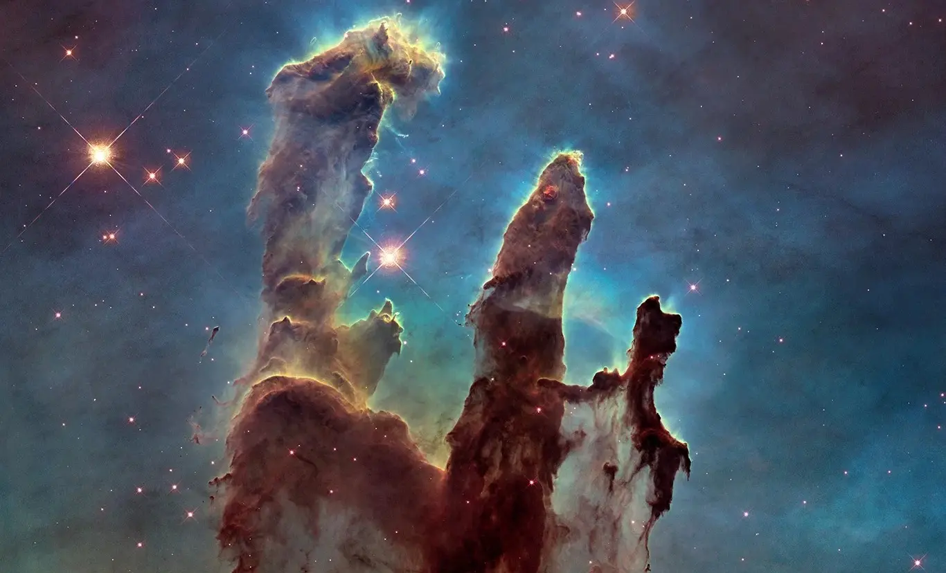 Imagem da notícia: Nasa divulga novas imagens dos 'Pilares da Criação', uma das estruturas mais bonitas da astronomia
