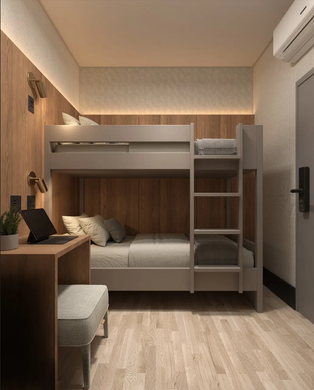 Quartos estarão equipados com beliches, mesa de trabalho, puff, cabides e suporte para mala.