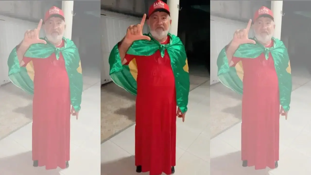 Vereador Carlos da Bodega com vestido vermelho